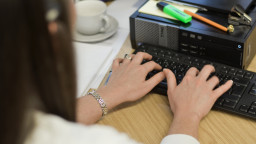 woman typing on computer